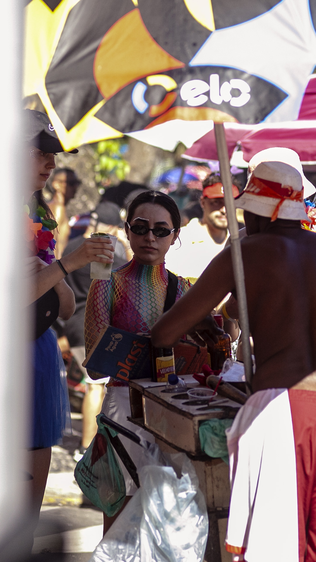 Local vendors add to the vibrant atmosphere, offering refreshing drinks and tasty treats to fuel the revelers.